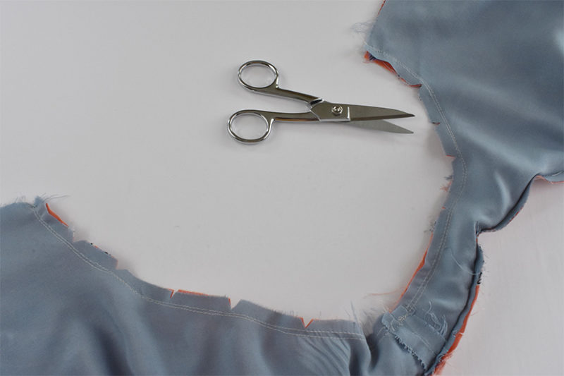 Armholes are shown sewn with seam allowance clipped. 
