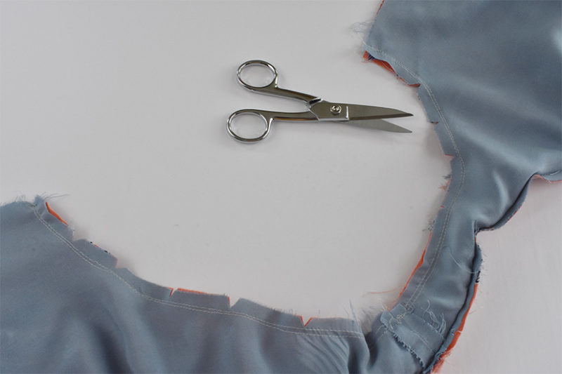 Armholes are shown sewn with seam allowance clipped.