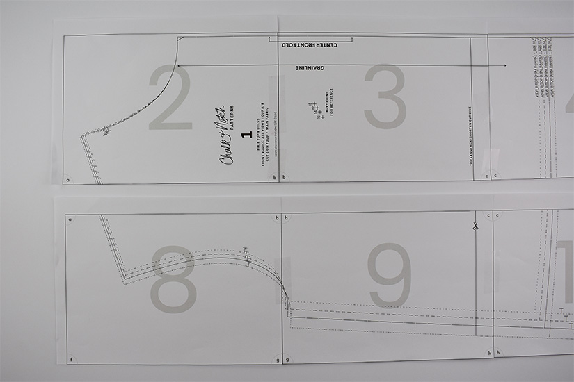 Two rows of a pdf sewing pattern are shown taped together. 