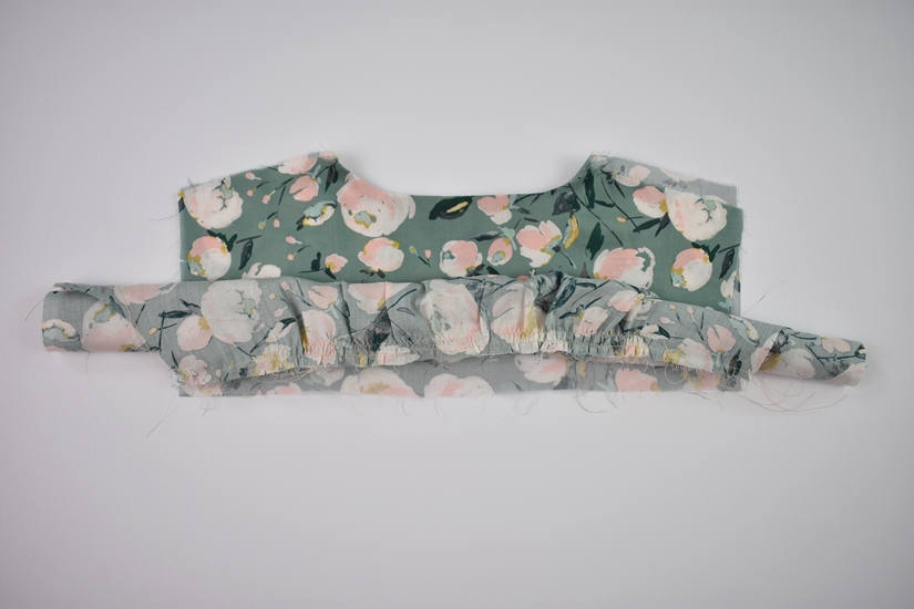 The bodice of the Orchid Midi is rolled up onto the back yoke.
