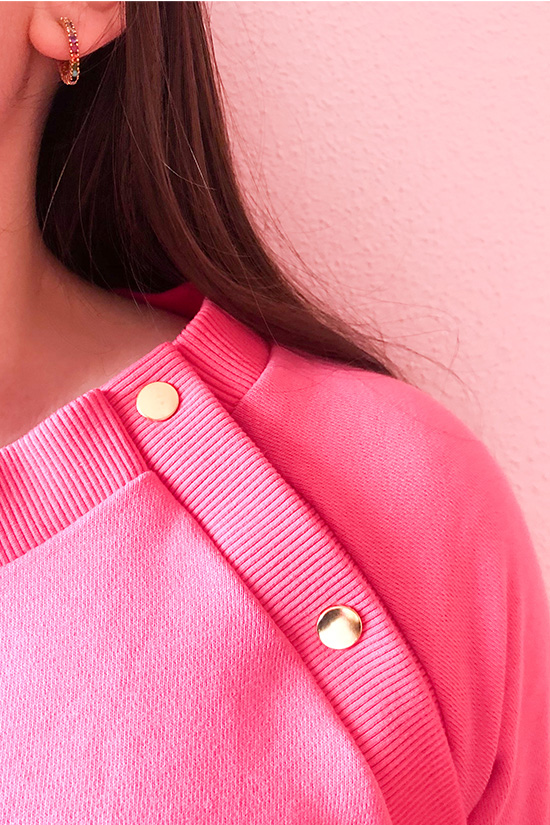 A close up of the page button shoulder sewing pattern hack