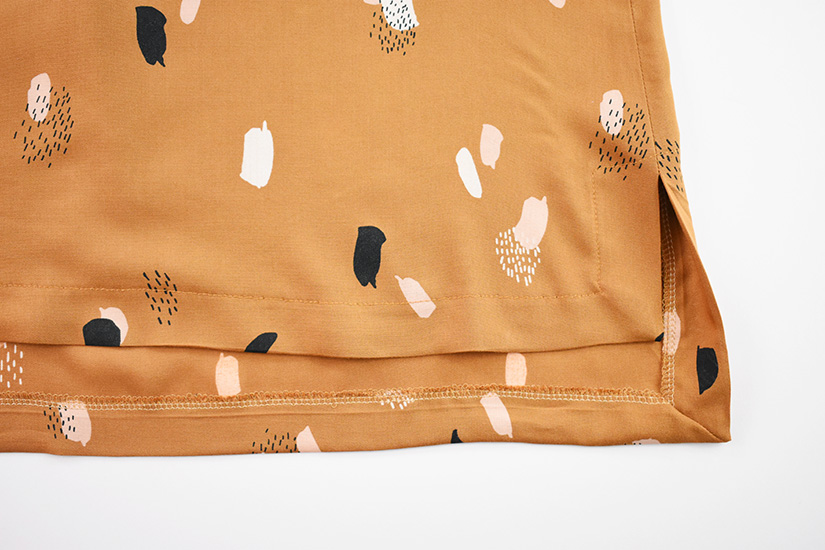 The hem of the Farrah sewing pattern is shown sewn.