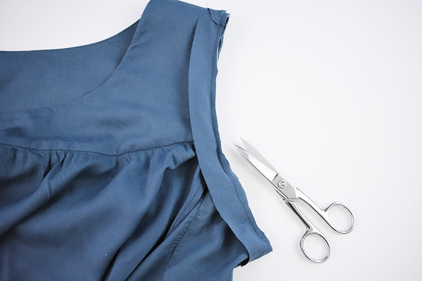 The armhole bias is shown sewn to the right side of the Farrah Blouse and Dress pattern.