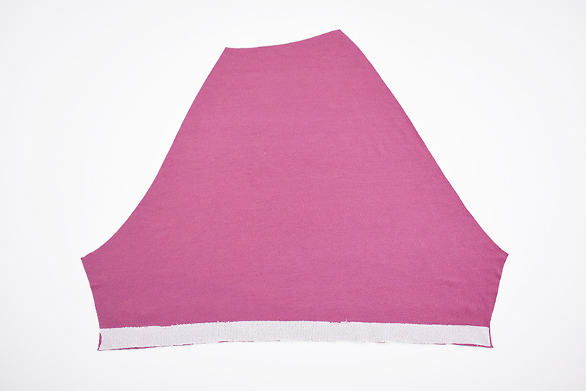 Interfacing is attached to the bottom of a sleeve hem.