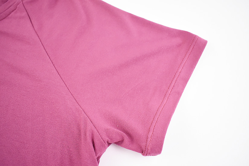 A sleeve hem sewn with a double needle is shown.