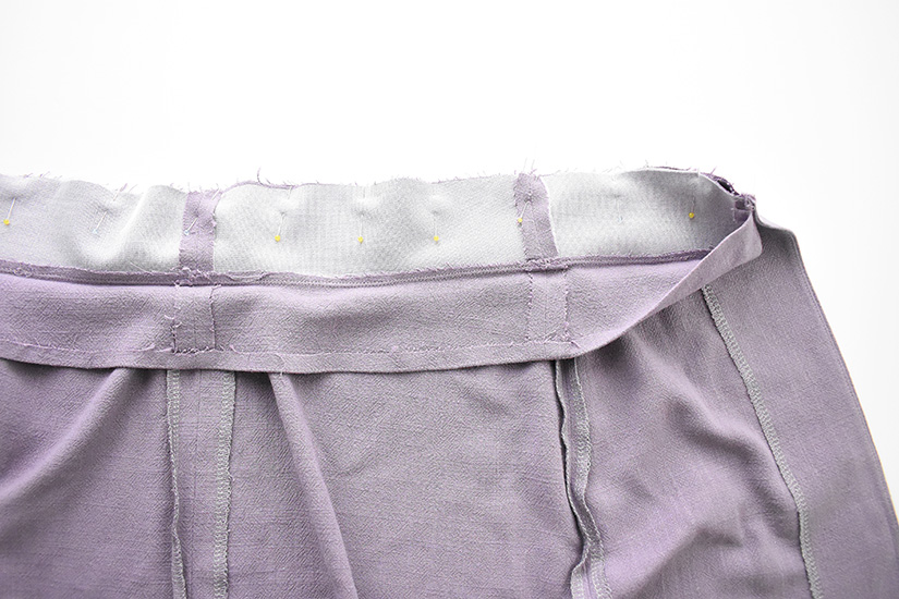 The waistband of the Evelyn Skirt is shown pinned to the skirt pieces. 