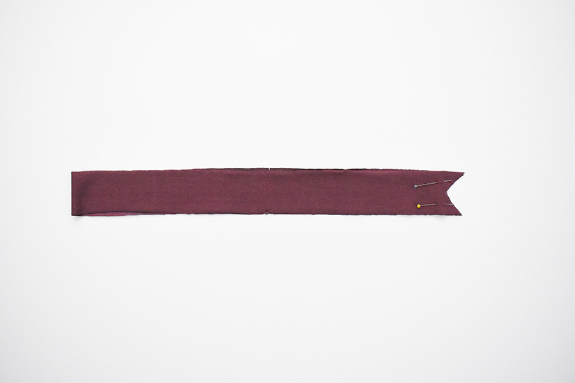 The Pony Tank neckband piece is shown pinned at the notched center front.