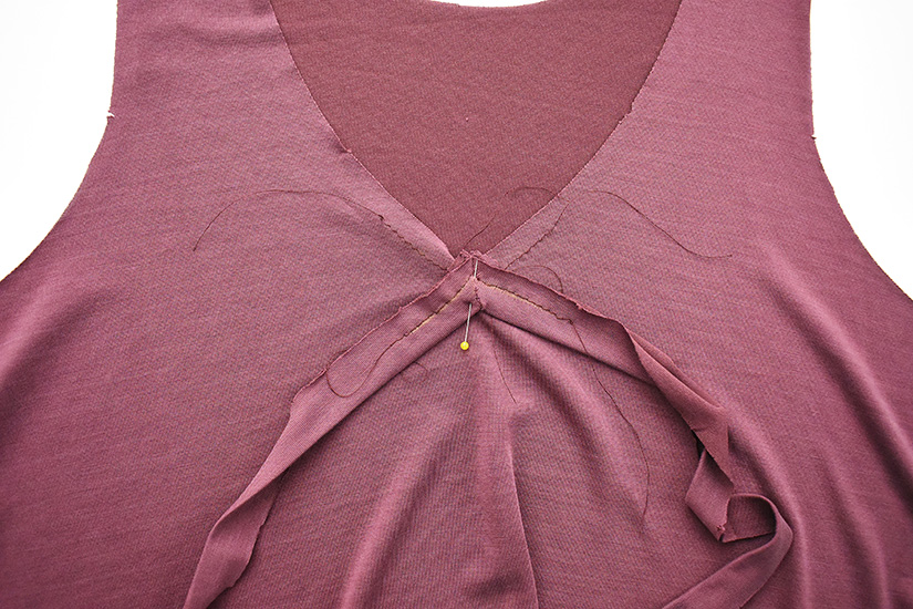 A pin is placed at the center front of the Pony Tank and holds the neckband to the bodice. 
