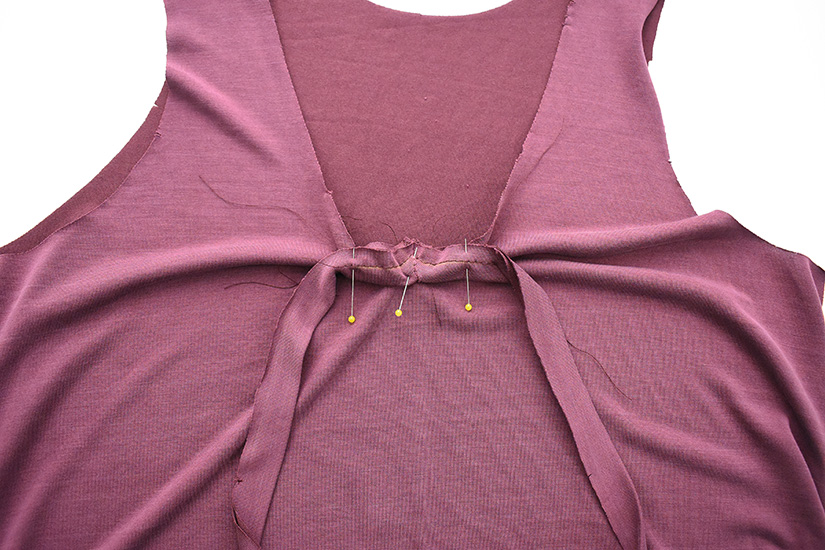 Three pins hold the neckband of the Pony Tank pinned at center front. 