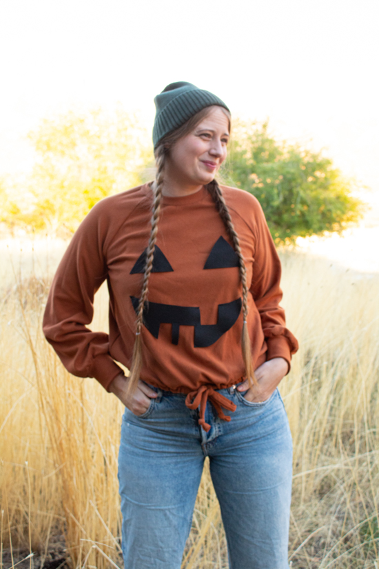 Nicole stands in her DIY Jack O'Lantern Halloween Costume