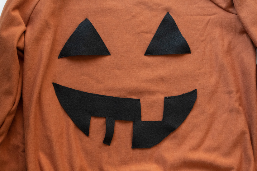 A Jack O'Lantern face is attached to make a DIY halloween costume