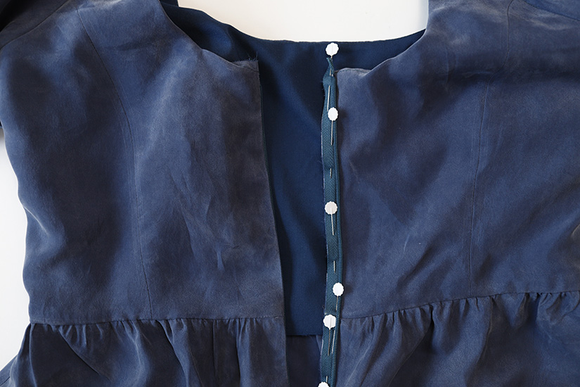 The invisible zipper is shown pinned to one side of the Shay view a bodice. 
