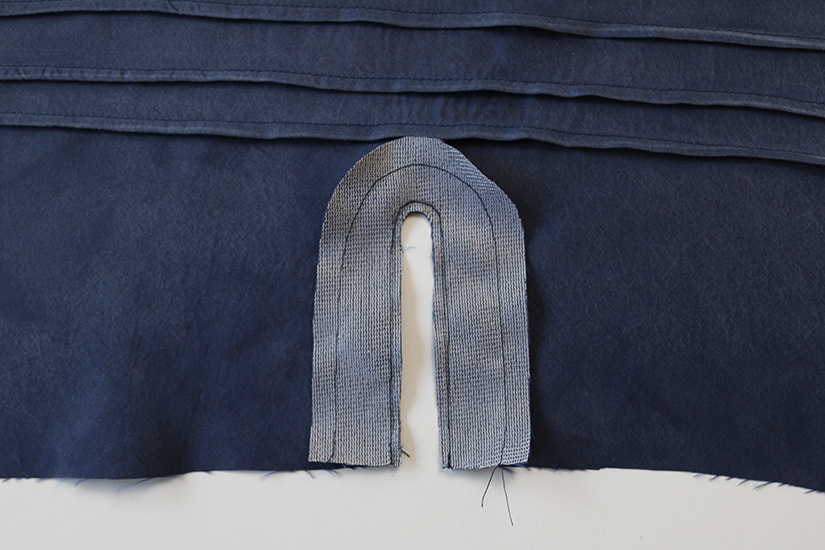 The sleeve placket facing is shown sewn to the sleeve. 