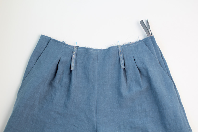 Front belt loops are shown pinned to the Crew Shorts sewing pattern
