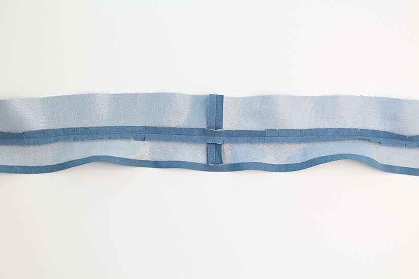 The Crew waistband seam is shown pressed open